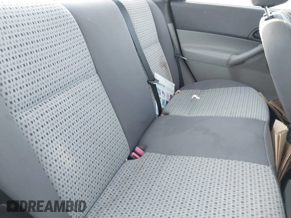 2007 Ford Focus S z VIN 1FAHP34N07W360761, wystawiony jako IAAI lot #40754946 z przebiegiem 121 371 mil mil oraz . Historia ofert i sprzedaży dostępna na DreamBid. Obrazek 8.