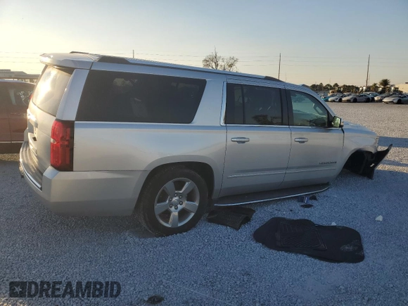 2020 Chevrolet Suburban Premier with VIN 1GNSCJKC9LR198484, listed as a Copart auction lot 87354514 with 115,008 mi miles and Salvage title. Bid and sale history available at DreamBid. Image 3.