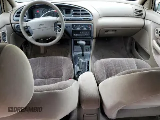 1996 Ford Contour с VIN 3FALP6535TM129390, выставлен на аукционе Copart как лот 73338064 с пробегом 87 588 миль миль и Списание • Salvage title. История ставок и продаж доступна на DreamBid. Изображение 8.