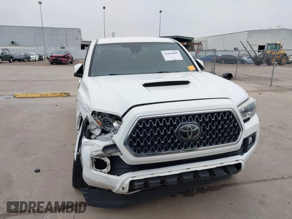 2019 Toyota Tacoma SR z VIN 3TMCZ5AN4KM220154, wystawiony jako IAAI lot #41602065 z przebiegiem 92 345 mil mil oraz . Historia ofert i sprzedaży dostępna na DreamBid. Obrazek 13.