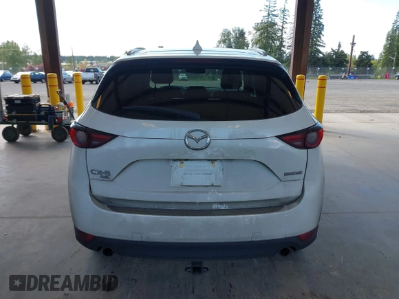 2020 Mazda CX-5 Grand Touring with VIN JM3KFBDM2L0863944, listed as a IAAI auction lot 42150805 with 63,932 mi miles and . Bid and sale history available at DreamBid. Image 16.