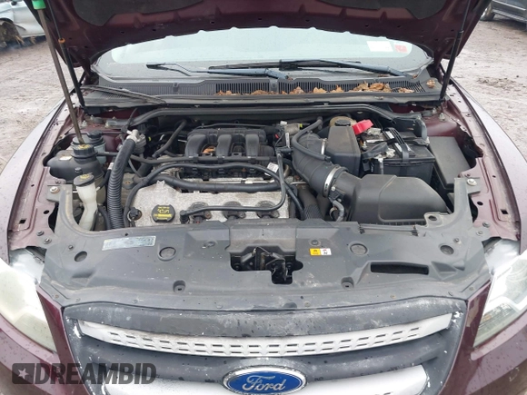 2011 Ford Taurus SE with VIN 1FAHP2DW7BG136988, listed as a IAAI auction lot 42002512 with 145,847 mi miles. Bid and sale history available at carsss.com. Image 10.
