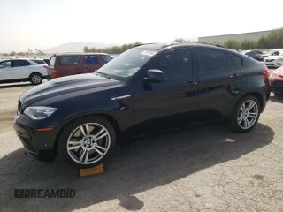2014 BMW X6 M with VIN 5YMGZ0C53E0C40799, listed as a Copart auction lot 71239134 with 100,036 mi miles and Salvage Title. Bid and sale history available at carsss.com. Image 1.