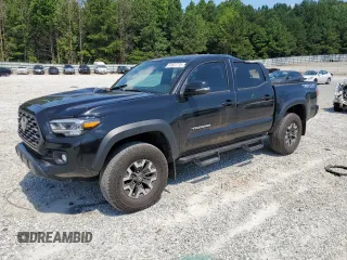 2023 Toyota Tacoma SR with VIN 3TMCZ5AN3PM571922, listed as a Copart auction lot 61872775 with 34,501 mi miles and Salvage title. Bid and sale history available at DreamBid. Image 1.
