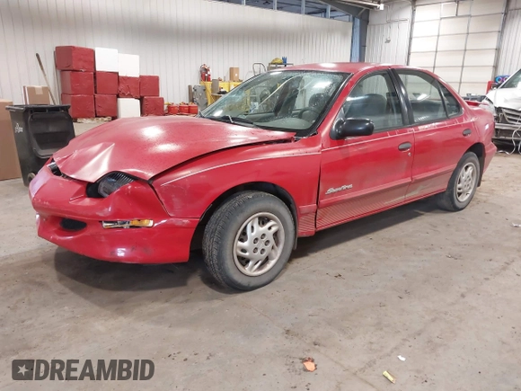 1999 Pontiac Sunfire SE z VIN 1G2JB524XX7547651, wystawiony jako IAAI lot #41962158 z przebiegiem 130 385 mil mil oraz . Historia ofert i sprzedaży dostępna na DreamBid. Obrazek 2.