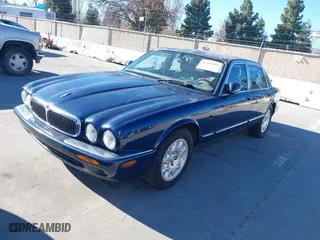 2000 Jaguar XJ with VIN SAJDA14C4YLF16529, listed as a IAAI auction lot 41387819 with 90,143 mi miles. Bid and sale history available at carsss.com. Image 2.