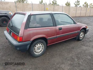 1987 Honda Civic z VIN JHMEC3427HS028239, wystawiony jako IAAI lot #41728725 z przebiegiem 113 710 mil mil oraz . Historia ofert i sprzedaży dostępna na DreamBid. Obrazek 4.