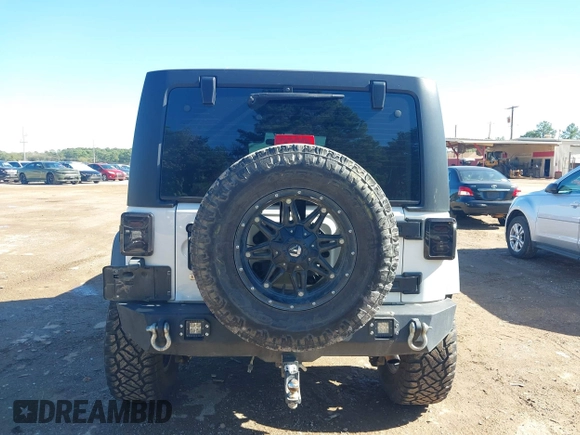 2017 Jeep Wrangler Unlimited Sport with VIN 1C4BJWDG4HL502861, listed as a IAAI auction lot 40895010 with 62,970 mi miles. Bid and sale history available at carsss.com. Image 16.