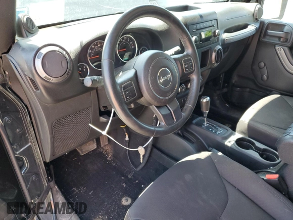 2014 Jeep Wrangler Sport with VIN 1C4AJWAG2EL113843, listed as a Copart auction lot 62771115 with 70,089 mi miles and Salvage title. Bid and sale history available at DreamBid. Image 8.