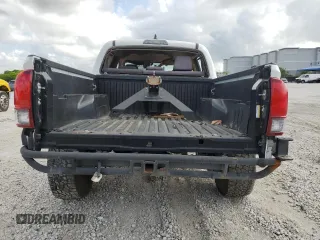 2021 Toyota Tacoma SR z VIN 3TMCZ5AN0MM411900, wystawiony jako Copart lot #58072365 z przebiegiem Nie podano mil oraz Nie do naprawy • Non repairable. Historia ofert i sprzedaży dostępna na DreamBid. Obrazek 6.