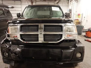 2007 Dodge Nitro SXT with VIN 1D8GU28K67W663621, listed as a IAAI auction lot 41691529 with 211,556 mi miles. Bid and sale history available at carsss.com. Image 6.
