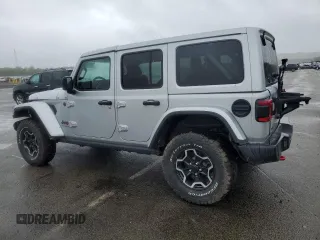 2023 Jeep Wrangler Rubicon with VIN 1C4JJXFM4PW589923, listed as a Copart auction lot 58725465 with 9,814 mi miles and Salvage title. Bid and sale history available at DreamBid. Image 2.