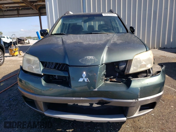 2005 Mitsubishi Outlander LS with VIN JA4LX31F65U020745, listed as a Copart auction lot 86270664 with 76,633 mi miles and Salvage Title. Bid and sale history available at carsss.com. Image 5.