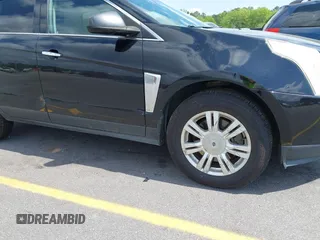 2014 Cadillac SRX with VIN 3GYFNAE30ES641616, listed as a IAAI auction lot 42000120 with 145,000 mi miles and . Bid and sale history available at DreamBid. Image 15.