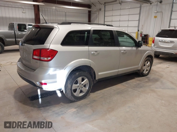 2012 Dodge Journey SXT z VIN 3C4PDDBGXCT257498, wystawiony jako IAAI lot #41746098 z przebiegiem 197 796 mil mil oraz . Historia ofert i sprzedaży dostępna na DreamBid. Obrazek 4.