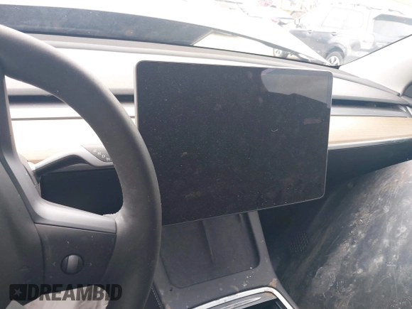 2023 Tesla Model Y Long Range with VIN 7SAYGDEE6PF824173, listed as a IAAI auction lot 41728613 with Not Provided miles and . Bid and sale history available at DreamBid. Image 7.