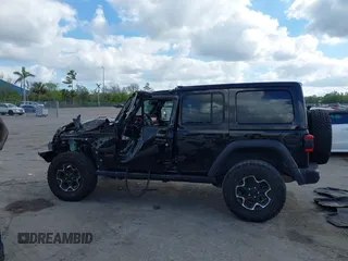2023 Jeep Wrangler Rubicon with VIN 1C4HJXFGXPW534515, listed as a IAAI auction lot 41524419 with 21,376 mi miles and . Bid and sale history available at DreamBid. Image 14.