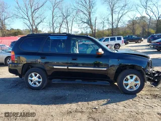 2005 GMC Envoy SLE with VIN 1GKDS13S152246568, listed as a IAAI auction lot 41293887 with 315,882 mi miles. Bid and sale history available at carsss.com. Image 13.