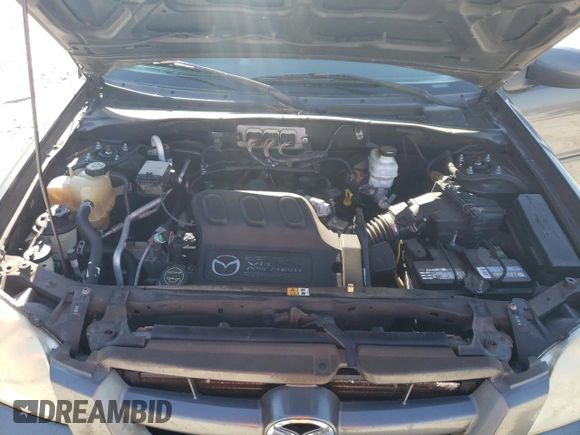 2006 Mazda Tribute S with VIN 4F2YZ04176KM19634, listed as a Copart auction lot 46796315 with 276,632 mi miles and Salvage Title. Bid and sale history available at DreamBid. Image 12.
