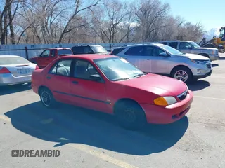 1999 Mazda Protege DX z VIN JM1BJ2229X0140042, wystawiony jako IAAI lot #41874832 z przebiegiem 186 222 mil mil oraz . Historia ofert i sprzedaży dostępna na DreamBid. Obrazek 1.