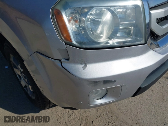 2011 Honda Pilot Touring with VIN 5FNYF4H96BB012122, listed as a IAAI auction lot 42071924 with 211,000 mi miles. Bid and sale history available at carsss.com. Image 6.