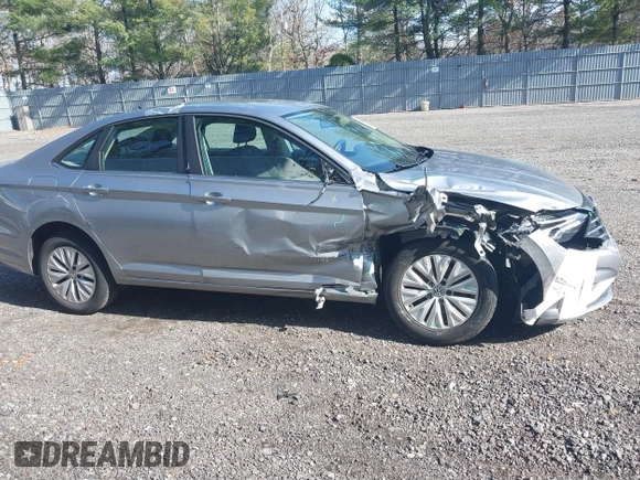 2019 Volkswagen Jetta S z VIN 3VWC57BUXKM242671, wystawiony jako IAAI lot #41813164 z przebiegiem 100 642 mil mil oraz . Historia ofert i sprzedaży dostępna na DreamBid. Obrazek 13.
