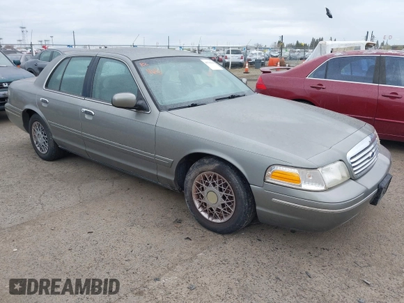 1999 Ford Crown Victoria LX z VIN 2FAFP74W4XX192490, wystawiony jako IAAI lot #41791909 z przebiegiem 115 469 mil mil oraz . Historia ofert i sprzedaży dostępna na DreamBid. Obrazek 1.