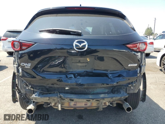 2018 Mazda CX-5 Grand Touring with VIN JM3KFBDM4J0348165, listed as a Copart auction lot 62733665 with 80,693 mi miles and Salvage title. Bid and sale history available at DreamBid. Image 6.