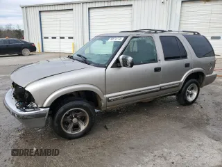 2001 Chevrolet Blazer LT z VIN 1GNCS13W012128782, wystawiony jako Copart lot #88874775 z przebiegiem 253 789 mil mil oraz Szkoda całkowita • Salvage title. Historia ofert i sprzedaży dostępna na DreamBid. Obrazek 1.