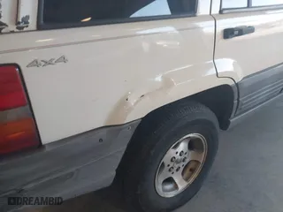 1997 Jeep Grand Cherokee Laredo with VIN 1J4GZ58SXVC552435, listed as a IAAI auction lot 41977888 with 143,832 mi miles. Bid and sale history available at carsss.com. Image 6.