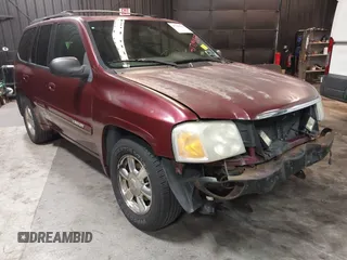 2002 GMC Envoy SLT with VIN 1GKDT13SX22426320, listed as a IAAI auction lot 41709359 with 104,418 mi miles. Bid and sale history available at carsss.com. Image 1.