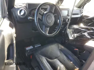 2015 Jeep Wrangler Unlimited Wrangler X with VIN 1C4BJWEG7FL580885, listed as a Copart auction lot 48891605 with 104,448 mi miles and Salvage title. Bid and sale history available at DreamBid. Image 8.
