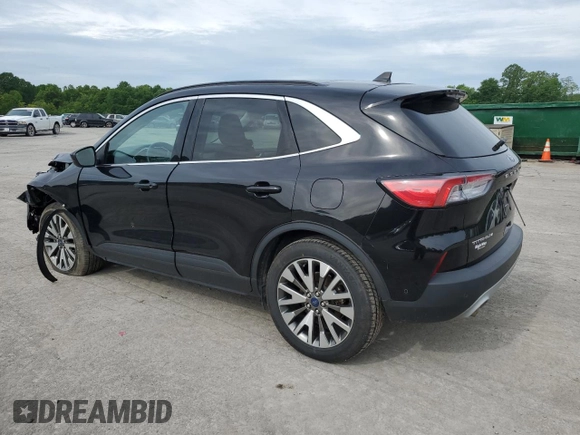 2021 Ford Escape Titanium with VIN 1FMCU9J97MUA57521, listed as a Copart auction lot 58714055 with 83,201 mi miles and Salvage title. Bid and sale history available at DreamBid. Image 2.