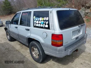 1996 Jeep Grand Cherokee Laredo with VIN 1J4EX58S1TC122268, listed as a IAAI auction lot 42005236 with 288,466 mi miles. Bid and sale history available at carsss.com. Image 3.