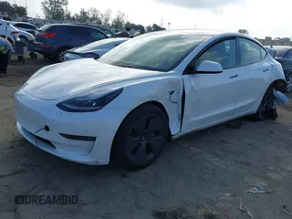 2022 Tesla Model 3 with VIN 5YJ3E1EA1NF167711, listed as a IAAI auction lot 41594266 with 50,554 mi miles and . Bid and sale history available at DreamBid. Image 2.