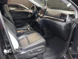 2021 Honda Odyssey Touring with VIN 5FNRL6H83MB040138, listed as a IAAI auction lot 39150096 with 61,322 mi miles and . Bid and sale history available at DreamBid. Image 5.