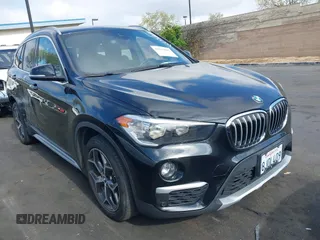 2019 BMW X1 sDrive28i with VIN WBXHU7C59K5L12320, listed as a IAAI auction lot 42116860 with 28,183 mi miles. Bid and sale history available at carsss.com. Image 1.