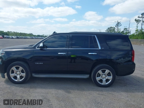 2015 Chevrolet Tahoe LT with VIN 1GNSCBKC1FR615817, listed as a IAAI auction lot 41760474 with 242,148 mi miles and . Bid and sale history available at DreamBid. Image 14.