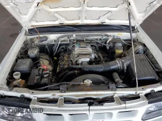 2000 Isuzu Rodeo S z VIN 4S2CK58W3Y4323965, wystawiony jako Copart lot #61189435 z przebiegiem 211 726 mil mil oraz Szkoda całkowita • Salvage title. Historia ofert i sprzedaży dostępna na DreamBid. Obrazek 11.