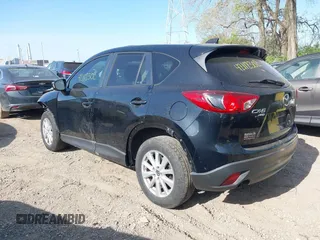 2014 Mazda CX-5 Touring z VIN JM3KE4CY4E0328880, wystawiony jako IAAI lot #42112302 z przebiegiem 185 228 mil mil oraz . Historia ofert i sprzedaży dostępna na DreamBid. Obrazek 3.