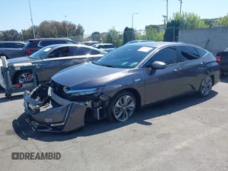 2018 Honda Clarity Touring z VIN JHMZC5F32JC024117, wystawiony jako IAAI lot #42312916 z przebiegiem 27 122 mil mil oraz . Historia ofert i sprzedaży dostępna na DreamBid. Obrazek 2.