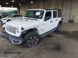2018 Jeep Wrangler Unlimited Sahara with VIN 1C4HJXEG3JW116404, listed as a IAAI auction lot 42152506 with 57,727 mi miles and . Bid and sale history available at DreamBid. Image 2.