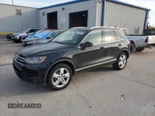 2013 Volkswagen Touareg Lux with VIN WVGEF9BP4DD005165, listed as a Copart auction lot 64056895 with 125,152 mi miles and Salvage title. Bid and sale history available at DreamBid. Image 1.