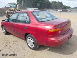 2001 Chevrolet Prizm with VIN 1Y1SK52891Z422344, listed as a IAAI auction lot 42095405 with 57,891 mi miles. Bid and sale history available at carsss.com. Image 3.