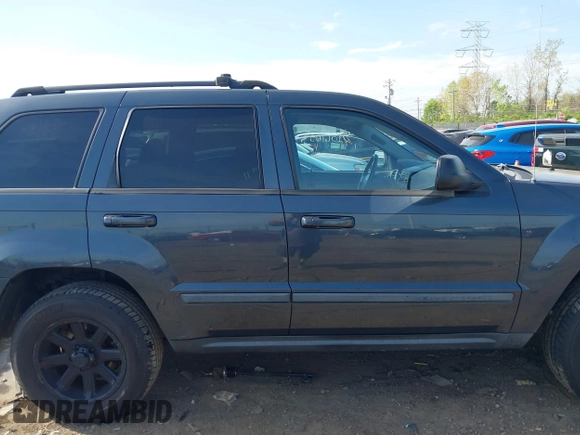 2007 Jeep Grand Cherokee Laredo with VIN 1J8GR48K77C582875, listed as a IAAI auction lot 42061653 with 259,767 mi miles. Bid and sale history available at carsss.com. Image 13.