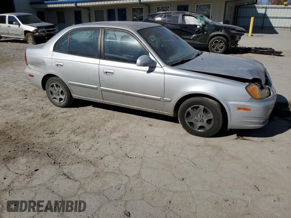 2005 Hyundai Accent GLS with VIN KMHCG45C75U638812, listed as a Copart auction lot 77968234 with 130,815 mi miles and Salvage Title. Bid and sale history available at carsss.com. Image 4.