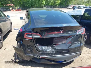 2022 Tesla Model Y Long Range z VIN 7SAYGDEE4NA006645, wystawiony jako IAAI lot #42192495 z przebiegiem 28 784 mil mil oraz . Historia ofert i sprzedaży dostępna na DreamBid. Obrazek 6.