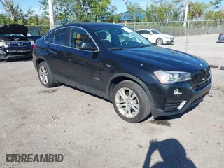 2016 BMW X4 xDrive28i with VIN 5UXXW3C51G0M89975, listed as a IAAI auction lot 41753869 with 93,351 mi miles. Bid and sale history available at carsss.com. Image 1.