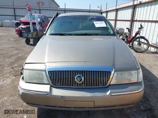 2004 Mercury Grand Marquis GS with VIN 2MEFM74W94X674014, listed as a IAAI auction lot 41973693 with 163,865 mi miles. Bid and sale history available at carsss.com. Image 11.