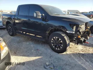 2024 Nissan Titan Pro-4X with VIN 1N6AA1ED5RN101017, listed as a Copart auction lot 43777785 with 30,489 mi miles and Salvage title. Bid and sale history available at DreamBid. Image 4.